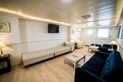 Athens: VIP Swimming Cruise to three islands - The VIP setup on board: sun deck, lounge, and weather cover