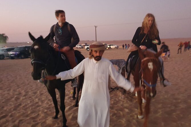 Dubai: All Inclusive Desert Safari with ATV, Camel, Horse ride, Vip & more - Al Awir camp welcome: coffee, shisha, henna, and falcon photos