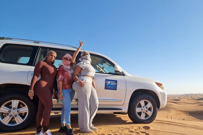 Dubai Red Dunes with Sandboarding, Camel Ride, Falcon & VIP Camp - Bedouin-style VIP camp: henna, belly dancer, tanoura, fire show
