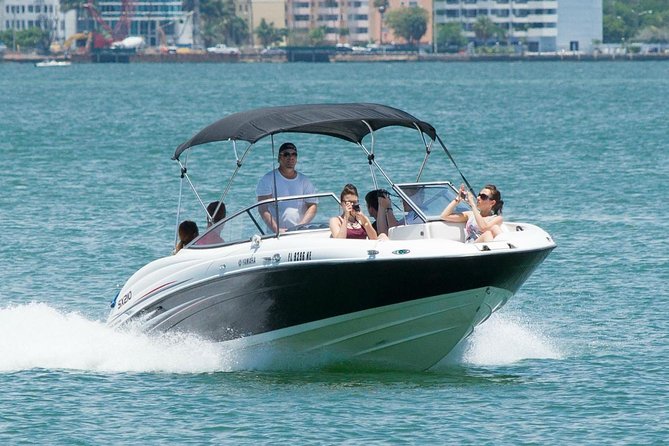 Fully Private Speed Boat Tours, VIP-style Miami Speedboat Tour of Star Island! - “Freedom” and the Cuban immigrant paperwork building: an important view from the coast