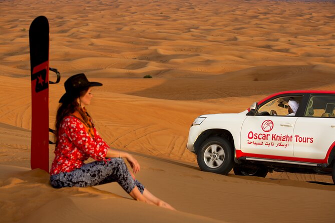 High Red Dunes with Camel Ride, Sandboarding, Falcon Show and VIP BBQ Dinner - Into the Desert: Pickup, the Land Cruiser Ride, and the Optional Quad Detour