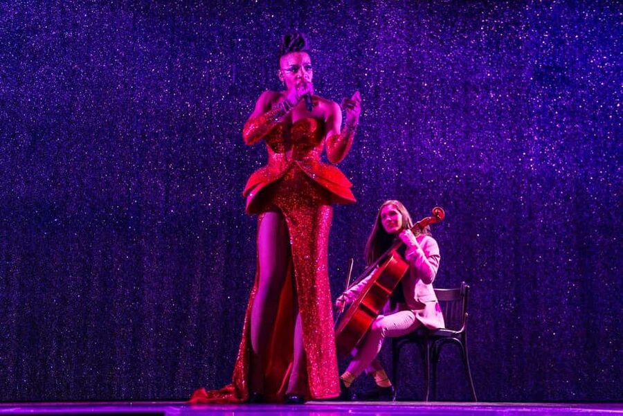 Paris: VIP Dinner and Cabaret Show at Paradis Latin - L’Oiseau Paradis on stage: costumes, acrobatics, and pacing