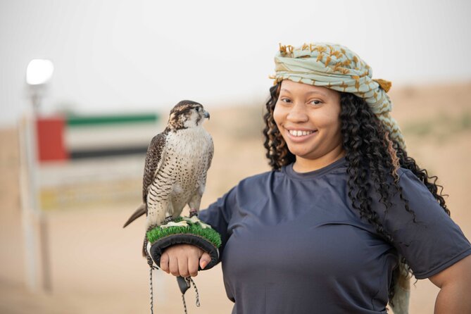 Premium Red Dunes Bashing with Quad Bike, Camel, Falcon &VIP Camp - Camel Farm and Bedouin Camp: The Desert Ship Moment