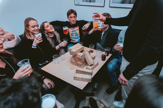 Pub Crawl + Unlimited Drinks + VIP entry + Drinking Games & Photographer - Stop 1: wristbands, games, and the first open-bar hour
