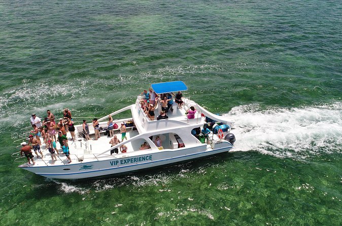 Sabina del Mar Party Boat VIP - Sandbar party energy: dancing, lounging, and the water slide surprise