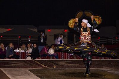 Sunset Camel Trekking with Falcon Show & VIP BBQ Dinner - Bedouin Camp Arrival: Coffee, Dates, Henna, and Falcon Time