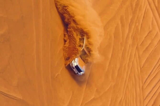 Thrilling dune bashing with VIP Desert camp delicious BBQ & shows - Camp arrival: camel rides, sand moments, and photo-friendly touches
