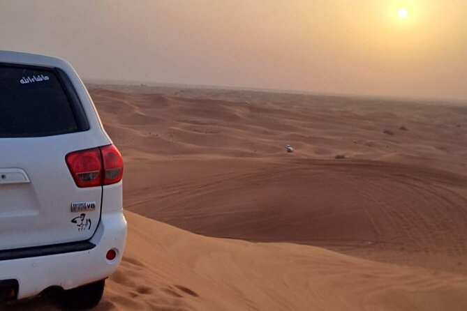 VIP Dubai Desert Safari with Quadbike,Sandboarding & BBQ dinner - The camp transfer in 4WD: switching from speed to sunset